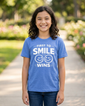 First to Smile Wins Youth Tee - Bright Colors